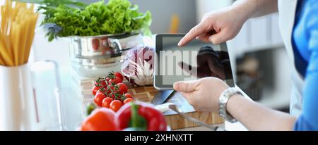 Vlogger chef showing ripe vegetables ingredients, video for culinary vlog Stock Photo