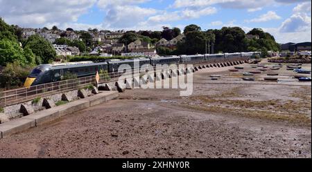 Intercity Express Train 1C72 the 0803 Paddington to Penzance passing the Teign estuary at low tide, headed by power car No 802102. Stock Photo