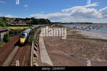 Intercity Express Train 1C73 the 0836 Paddington to Paignton passing the Teign estuary at low tide headed by power car No 802104. Stock Photo