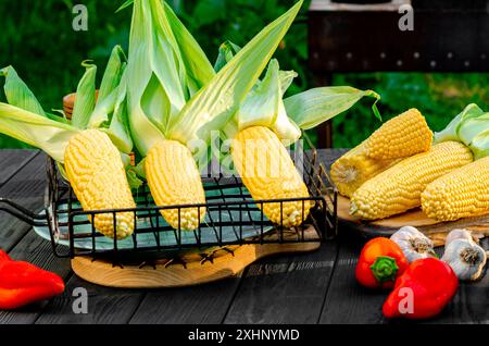 Sweet baby corn on a grill. Picnic in the garden. Stock Photo
