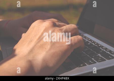 Close-up of the programmer's hands on the keyboard. Freelancer Stock Photo
