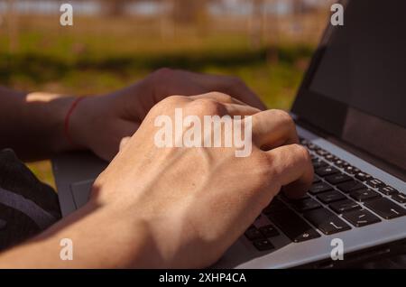 Close-up of the programmer's hands on the keyboard. Freelancer Stock Photo