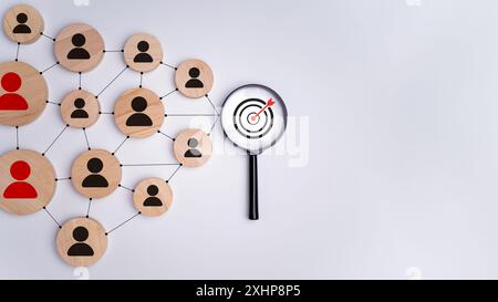 Wooden block with target icon linked with human icons for customer focus group, Customer relationship management concept, CRM, Customer relationship m Stock Photo