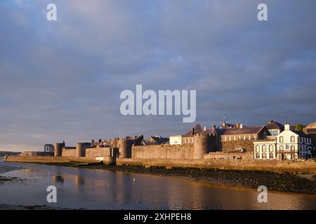 The medieval town walls of Caernarfon on the North Wales coast, a World Heritage Site Stock Photo