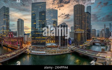 Aerial view of iconic high-rise buildings along the Chicago river on the magnificent mile with dramatic sky Stock Photo