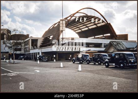 WATERLOO AIR TERMINAL 1950's BEA Terminal passenger reception and check in facility and heliport at Waterloo Station with arriving black cab taxis waiting on rank London 1956 UK  The Waterloo Air Terminal was a passenger reception, check-in facility and heliport on the South Bank of the River Thames in London. It was used by British European Airways (BEA) and other European airlines between 1953 and 1957, when it was replaced by the West London Air Terminal. Stock Photo