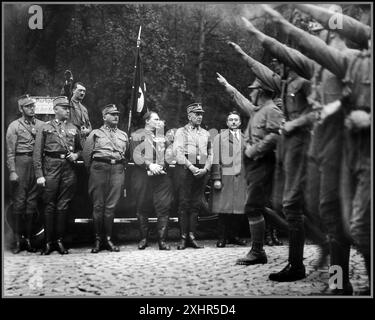 1931 Nazi Germany The founding of the Harzburg Front (German: Gründung der Harzburger Front). Photo taken on October 11th, 1931 in Bad Harzburg showing: Parading SA troops (Sturmabteilung) saluting some of the leadership of the Nazi Party (NSDAP) delegation at the joint session of the national rights: Gerret Korsemann (1895–1958), later SS and police general Viktor Lutze (1890–1943), Reichstag representative for Hannover-Braunschweig, later SA leader (1934–1943) Adolf Hitler (1889–1945), Nazi Party leader Ernst Röhm (1887–1934), Sturmabteilung (SA) chief 1931–34 Hermann Göring (1893–1946), Stock Photo