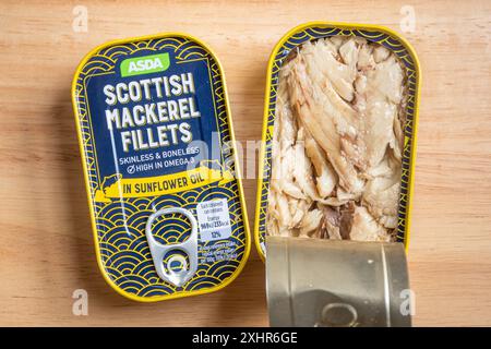 Two tins or cans of Asda Scottish mackerel fillets, one opened. Canned or tinned fish or food Stock Photo