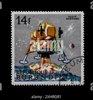 Cancelled postage stamp from the Republic of Burundi. Depicting scenes from space exploration series released in May 1968. Luna lander firing retro's. Stock Photo