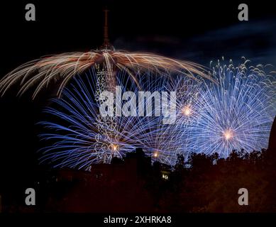 Paris, France - 07 14 2024: July 14 fireworks fired from The Eiffel Tower in Paris Stock Photo