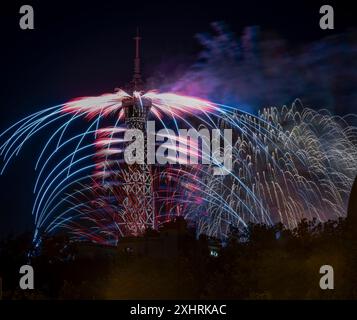 Paris, France - 07 14 2024: July 14 fireworks fired from The Eiffel Tower in Paris Stock Photo