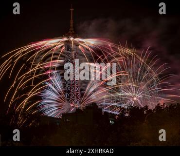 Paris, France - 07 14 2024: July 14 fireworks fired from The Eiffel Tower in Paris Stock Photo