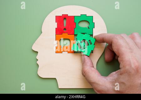 Head with puzzles about negotiations skills or mediation. Stock Photo