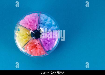 Donut shaped container with colorful rubber bands Stock Photo