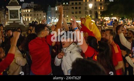 Spanish Fans celebrate Spain's win over England in the Euro finals at Trafalgar Square. Trafalgar Square (Central London), United Kingdom. Stock Photo