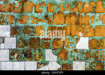 Colorful Concrete Wall Background With Old Crumbling White Tiles On Light Green Plaster Stock Photo