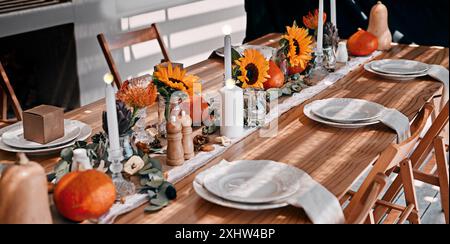 Table, thanksgiving and decoration for celebration in home, dining and traditional place setting. Party, festive season and preparation for social Stock Photo