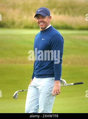 Rory McIlroy reacts after hitting his tee shot on the 12th hole during ...