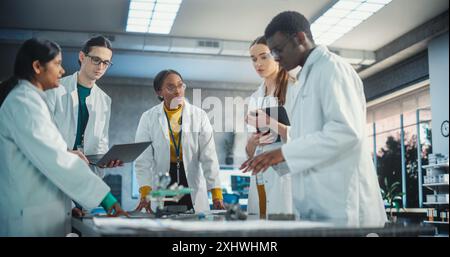 electrical engineers using laptop computer in electric substation Stock ...