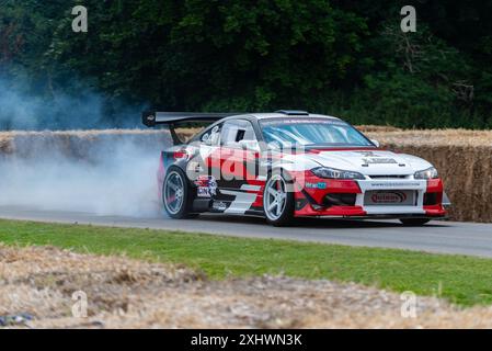 2000 Nissan Silvia S15 drift car driving up the hill climb track at the Goodwood Festival of Speed 2024 motorsport event in West Sussex, UK Stock Photo