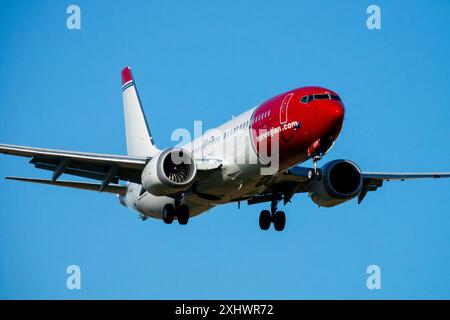 Boeing 737 Norwegian Airlines Plane Flying in Sky Prague Czech Republic Stock Photo