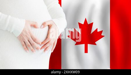 Demographics, pregnancy and love baby in Canada concept. Pregnant woman making heart against her stomach on Canadian flag background. Stock Photo