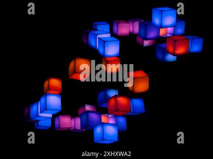 multicolour cubes floating in the air in the dark background Stock Photo