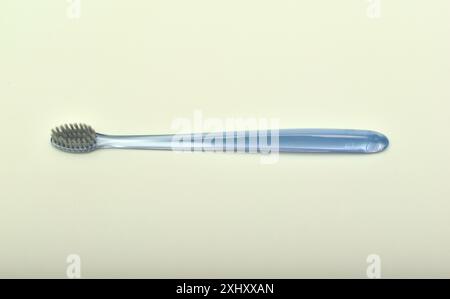 Transparent toothbrush on a green background. Stock Photo