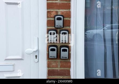 Key Lock Boxes at the entrance of property, Epsom, Surrey, UK Stock Photo