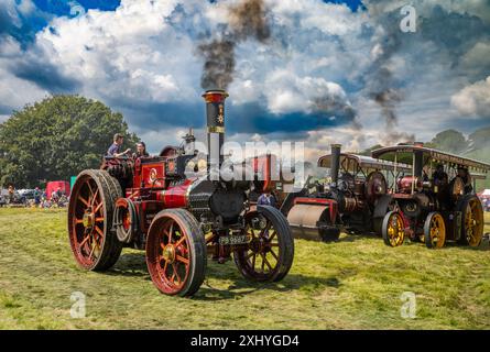 Storrington / UK - Jul 13 2024: Vintage steam traction engines, steam rollers and steam trucks on display at at Sussex Steam Rally. Stock Photo