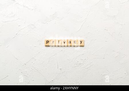 privacy word written on wood block. privacy text on table, concept. Stock Photo