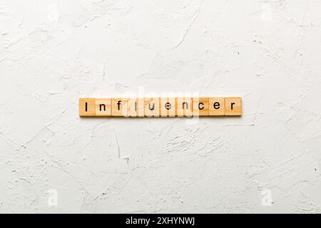influencer word written on wood block. influencer text on table, concept. Stock Photo