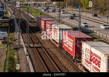 Gothenburg, Sweden - May 01 2022: Long container freight train moving southbound out of Gothenburg. Stock Photo