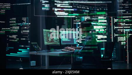 Female Programmer Working in Monitoring Control Room, Surrounded by Big Screens Displaying Lines of Programming Language Code. Portrait of Woman Creating a Software. Abstract Futuristic Coding Concept Stock Photo