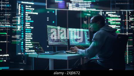 Black Male Developer Typing on Computer, Surrounded by Transparent Screens Showing Code Prompts. Professional Programmer Creating Complex Software, Running Coding Tests. Futuristic Programming Concept Stock Photo