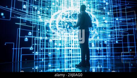 Back View of Young Man Looking at a Big Screen with Neural Network 3D Visualisation. Professional Computer Data Science Engineer Working in System Control and Monitoring Telecommunications Stock Photo