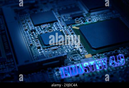 Electronic board with surface-mounted IC and passive components close up. Industry 4.0 Industrial Automation Concept Stock Photo