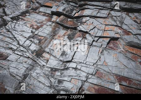 detailed closeup of beautiful grey slate rock formation texture with cracked pattern effect, natural stone background Stock Photo