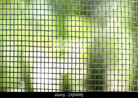 Insect screen for window against blurred background, closeup Stock Photo