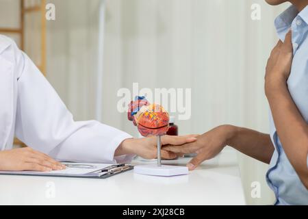 A heart patient attended a hospital for a checkup with a doctor after experiencing chest pain. Doctors are advising patients to take care of their hea Stock Photo