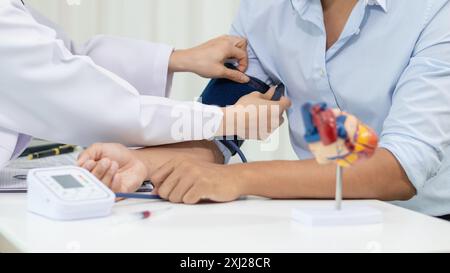 A heart patient attended a hospital for a checkup with a doctor after experiencing chest pain. Doctors are advising patients to take care of their hea Stock Photo