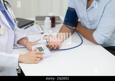 A heart patient attended a hospital for a checkup with a doctor after experiencing chest pain. Doctors are advising patients to take care of their hea Stock Photo