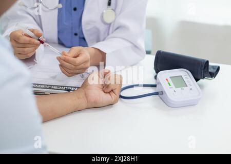 A heart patient attended a hospital for a checkup with a doctor after experiencing chest pain. Doctors are advising patients to take care of their hea Stock Photo