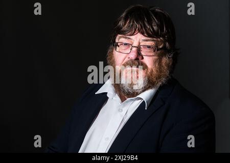 Edimburgh, Scotland. 20 August, 2018. Scottish writer John Burnside attends a photocall during the Edinburgh International Book Festival Stock Photo