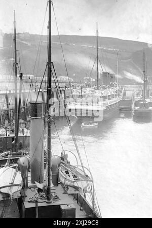 A steamer coaling up at the old Breakwater Pier, Douglas, Isle of Man. Steamer named Ben My Chree. This photograph is from an Edwardian original, around 1910. The original was part of an album of150 albumen photographs, of variable quality, many of which I have photographed. The collection included images particularly from the Isle of Man and the English county, Devonshire. Annotations were included in the album but, unfortunately, there were no specific dates. Original photos were, on average 6x4 ½ inches. Stock Photo