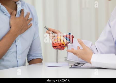 A heart patient attended a hospital for a checkup with a doctor after experiencing chest pain. Doctors are advising patients to take care of their hea Stock Photo