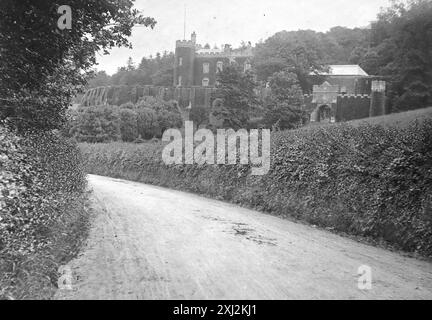 Watermouth Castle, viewed from the road, near Ilfracombe, Devon. This photograph is from an Edwardian original, around 1910. The original was part of an album of150 albumen photographs, of variable quality, many of which I have photographed. The collection included images particularly from the Isle of Man and the English county, Devonshire. Annotations were included in the album but, unfortunately, there were no specific dates. Original photos were, on average 6x4 ½ inches. Stock Photo