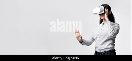 Woman Wearing Virtual Reality Headset Interacting With Virtual World Stock Photo