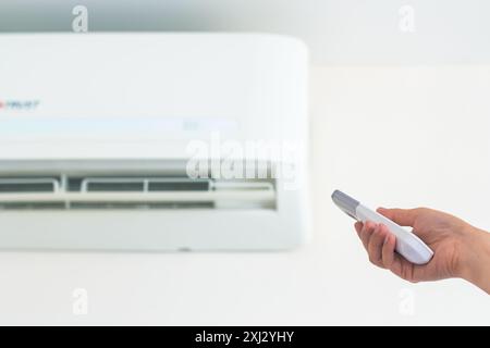 AC wall unit, remote control. Stock Photo