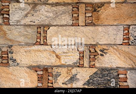 Background photography of old; wall; texture; stone; rock, age; ancient; cracked; historical; section; pattern; aging; architecture; facades Stock Photo